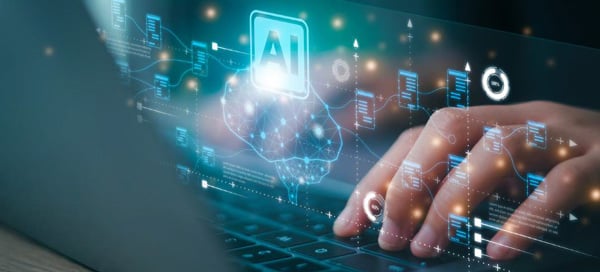 AI concept typing on laptop