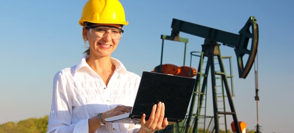 Woman in hard hat with computer