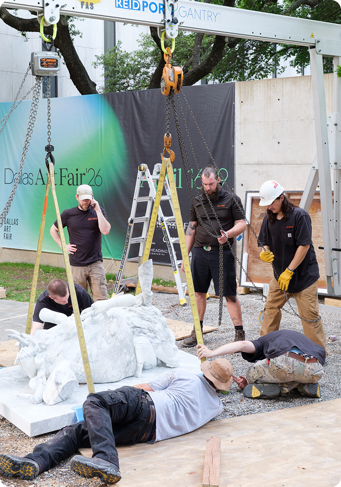 Technicians installing artwork