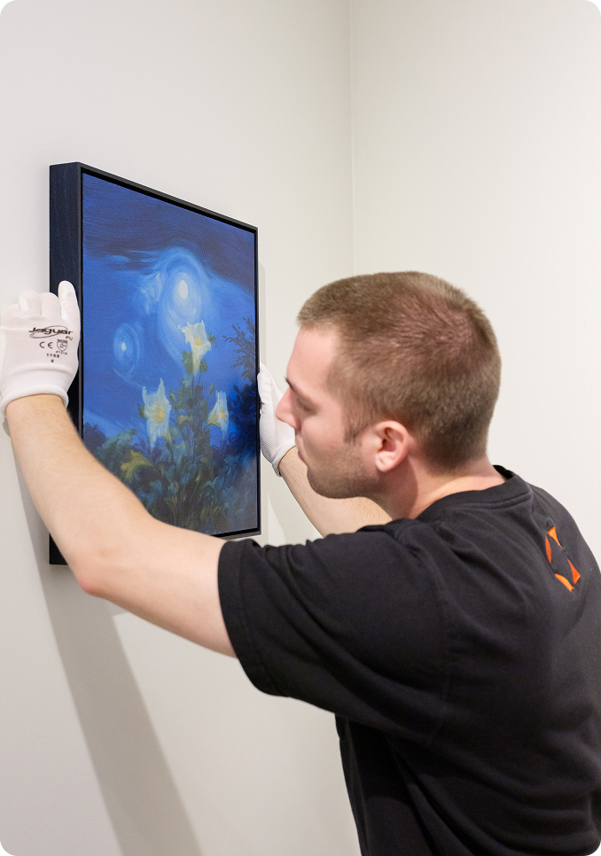 Technician installing painting