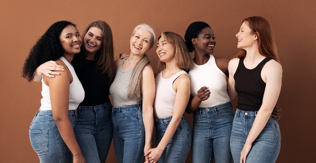 SIx women in jeans and white tops