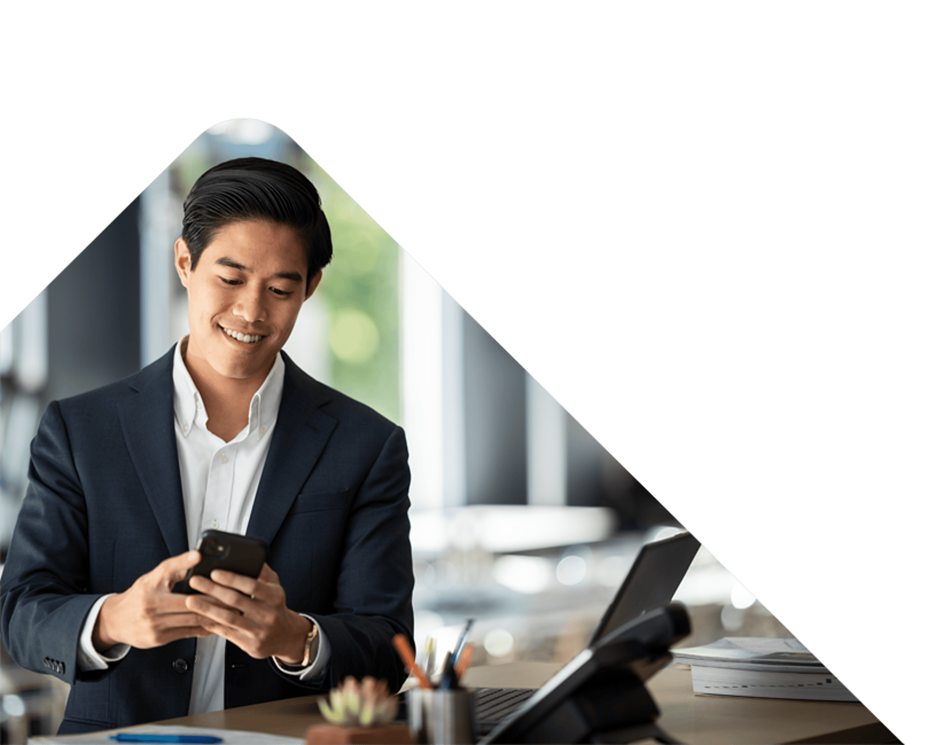 Business man smiling at phone