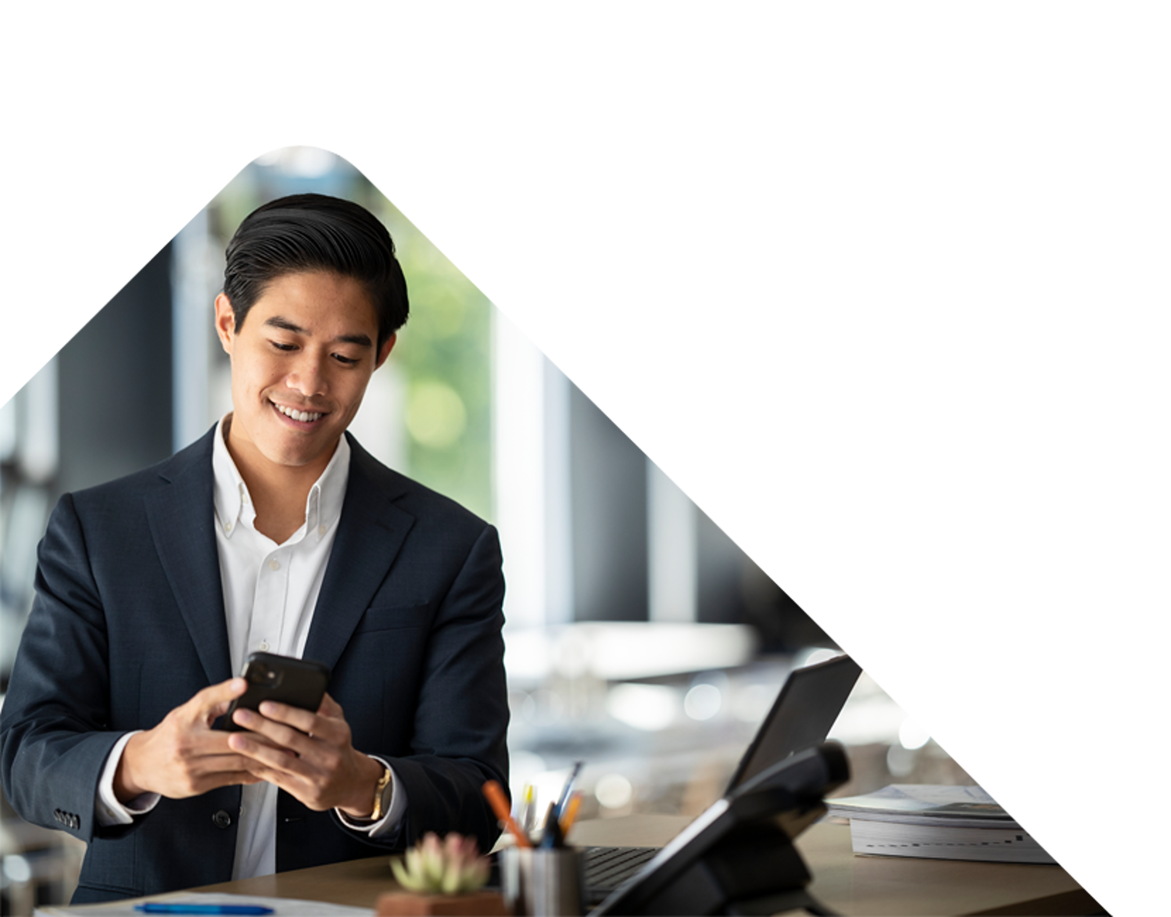 Business man smiling at phone