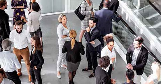 Electronic Content Classification Service- People conversing at a convention