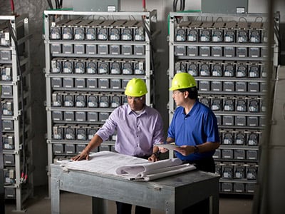 two builders looking at plans