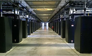 A photo of a long hallway in a hyperscale data center