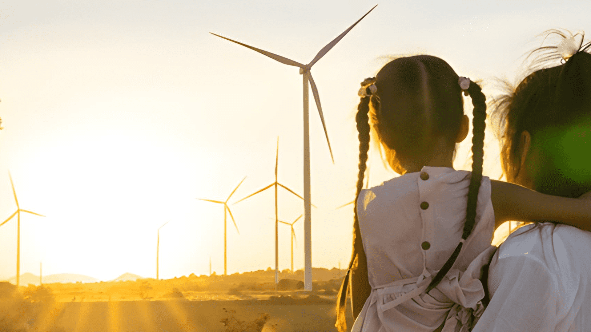 Data centers sustainability - mother and daughter looking at the windmills