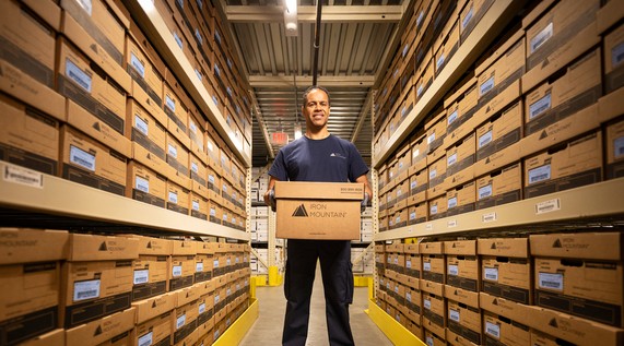 IM warehouse man holding box