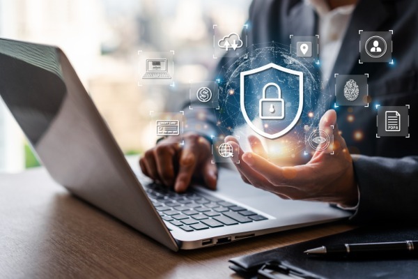 Businessman using smart devices with global network connection and cyber security business data protection technology License Type: media