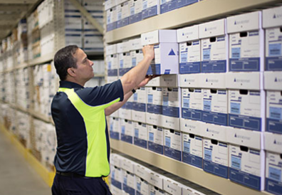 Iron Mountain employee pulling boxes