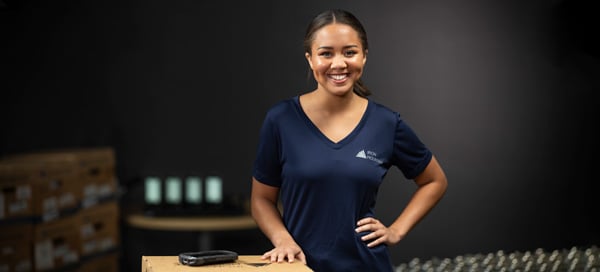 Iron Mountain employee standing next to box