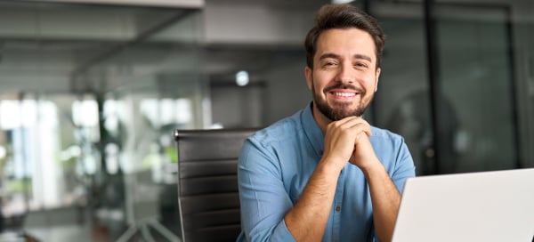 Man sitting in front of a desk