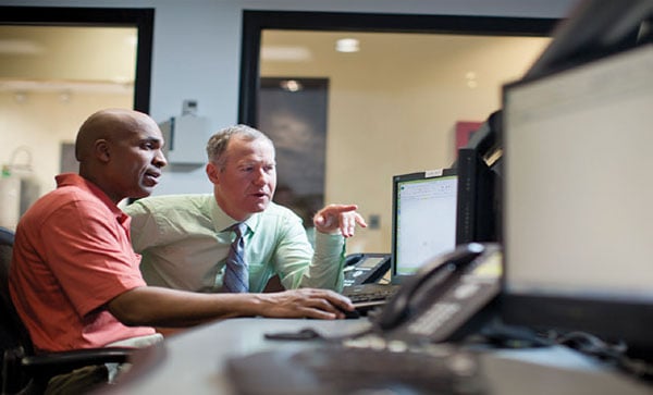 People Looking At Desktop Iron Mountain Information Governance Program Development Service | Iron Mountain