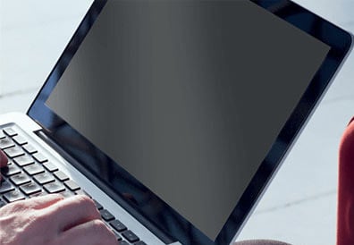 Typing on a laptop