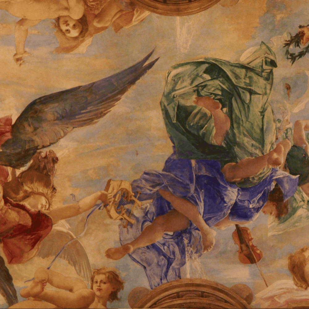 Classical ceiling fresco featuring winged angelic figures in flowing blue and green drapery alongside musical instruments set against a sky.