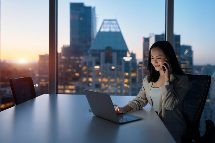 Woman working with view of skyscrapers