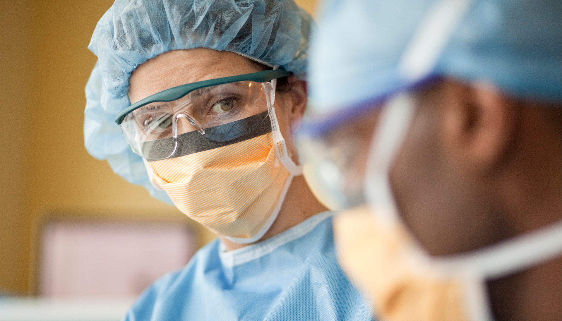 healthcare worker closeup in blue scrubs