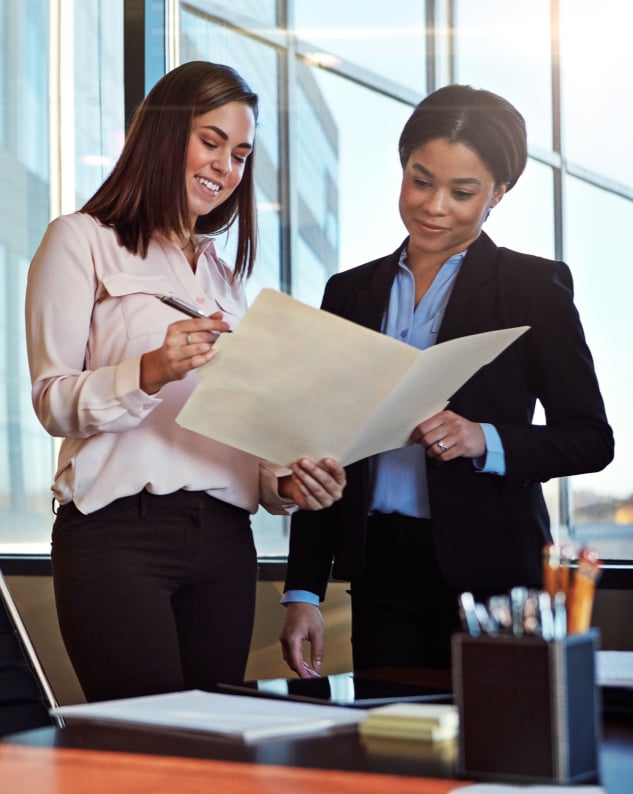 Employees reading law documents