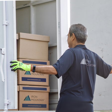 backside of IM worker unpacking truck