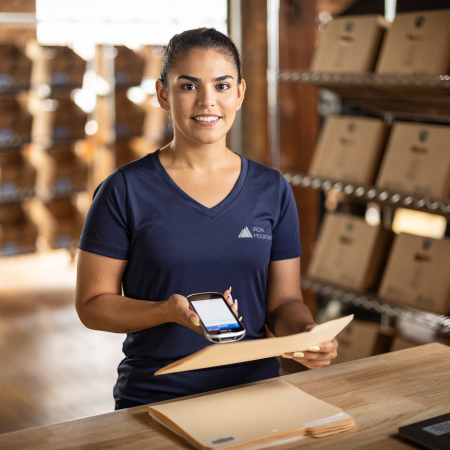 portrait of IM worker with files