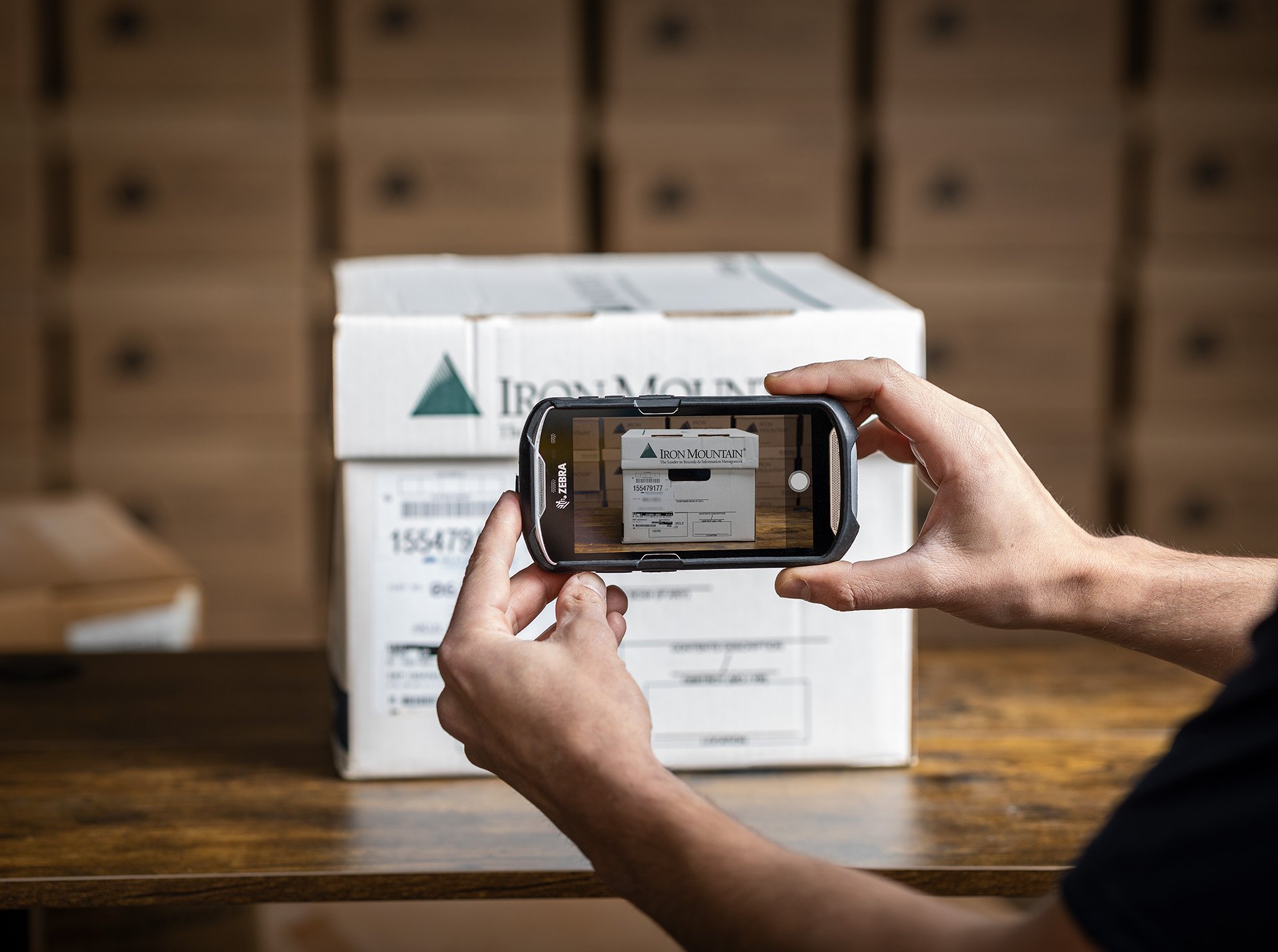 IM worker taking picture of IM box