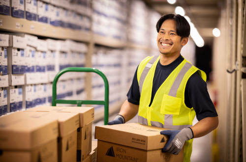 Man holding box in warehouse
