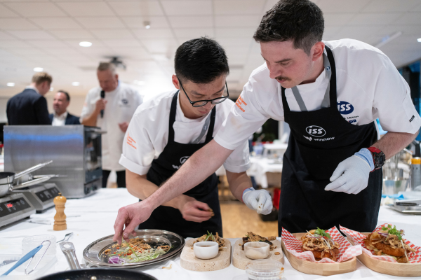 ISS International Culinary Competition 2023 winners Eason Chen and Jake Leach preparing their winning dishes