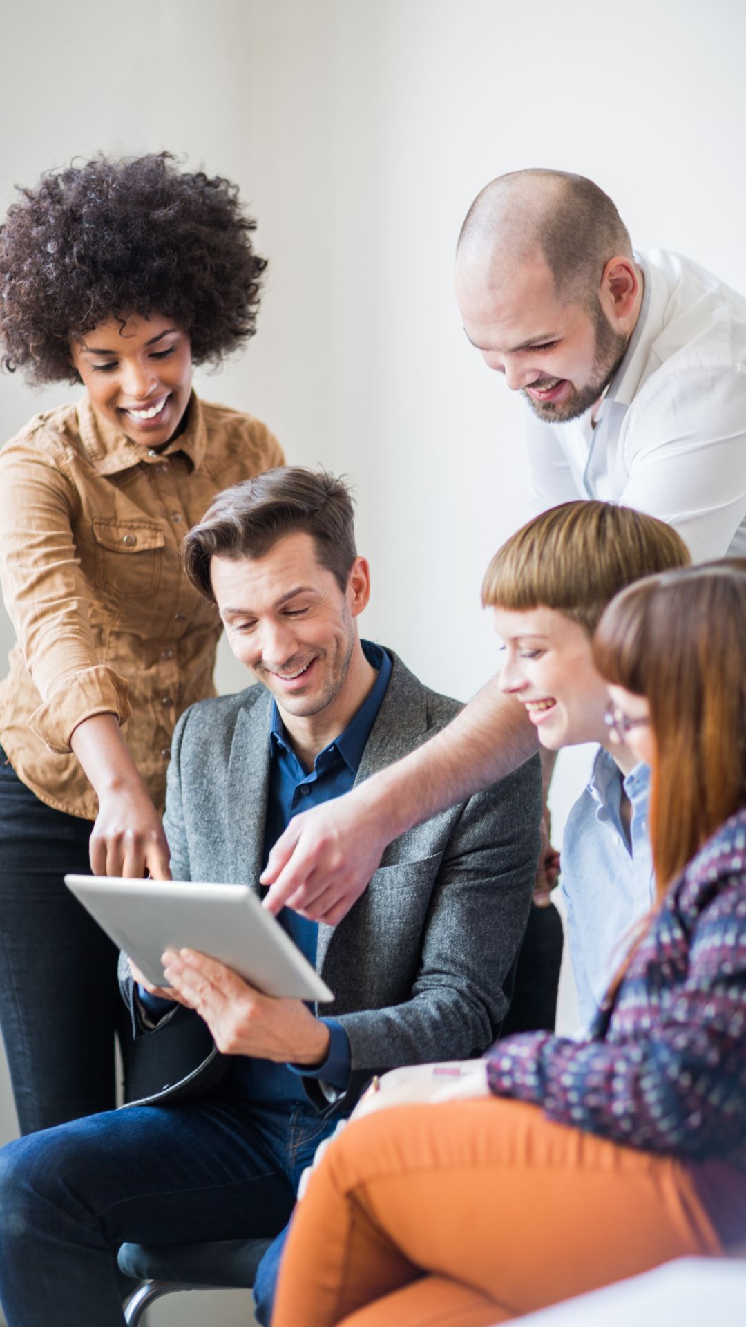 People working together on a tablet