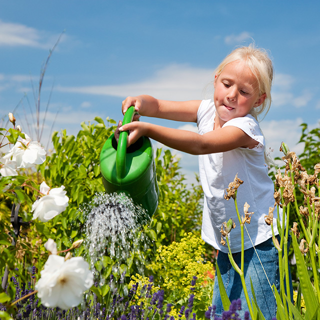Girl-watering-flowers
