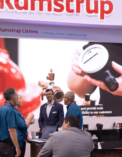 Guys talking in ACE Booth