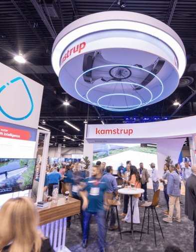 A group in the Kamstrup booth at ACE 2024