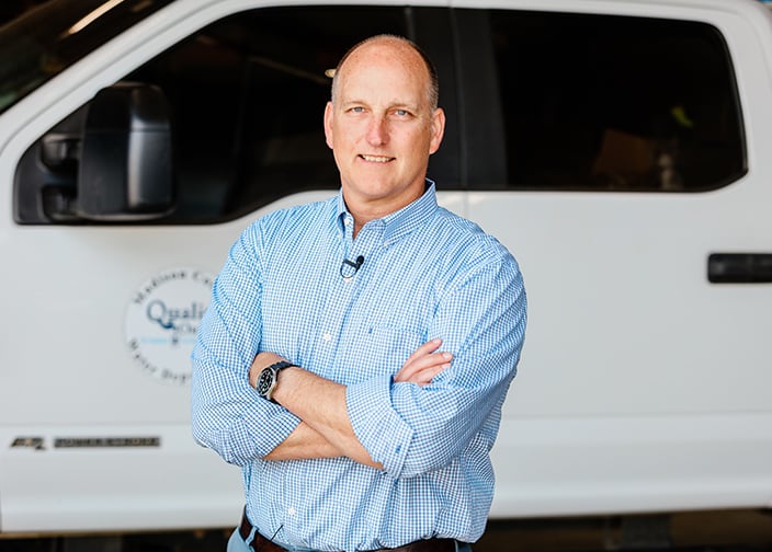 Image of Chuck Faulkner, County Engineer, Madison County, Alabama in front of work truck