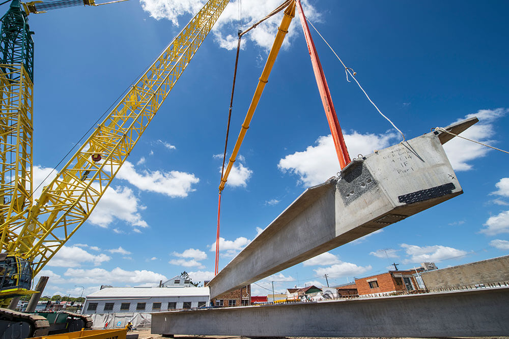 A crane lifting a large piece of infrastructure