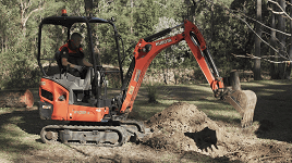 Operating the excavator to start digging