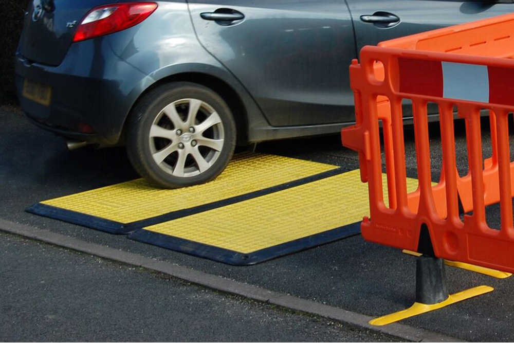 kennards hire yellow and black road plate in operation