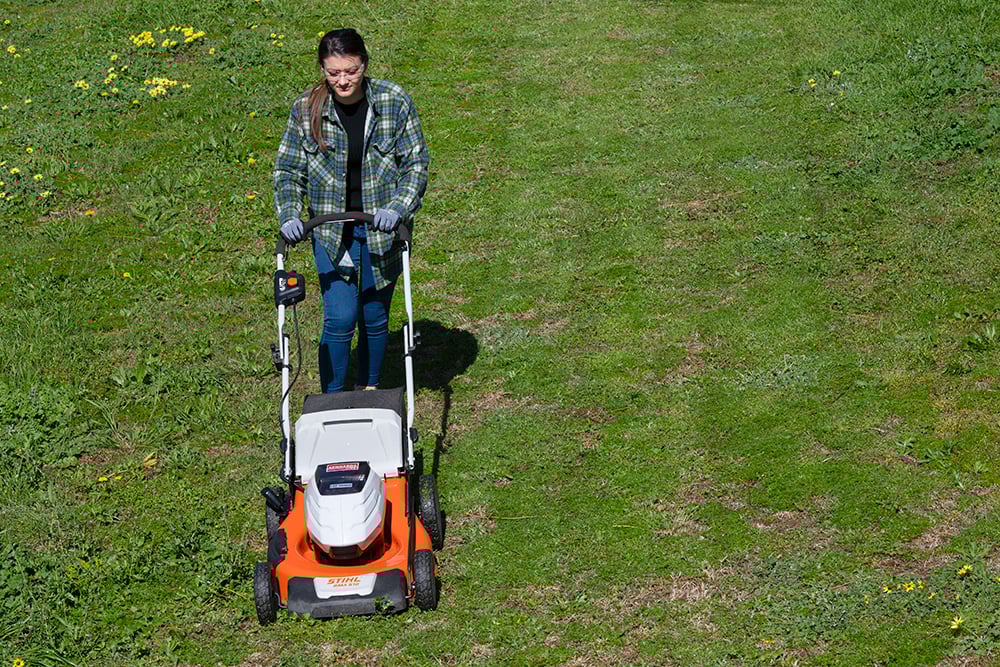 Kennards Hire lawn mower being used by a customer
