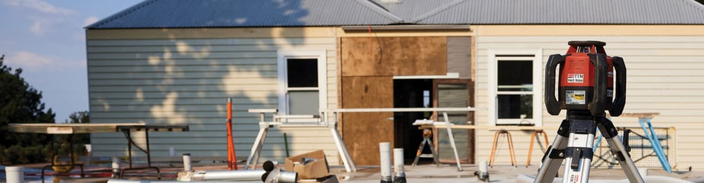 Surveying tool situated on a residential construction site