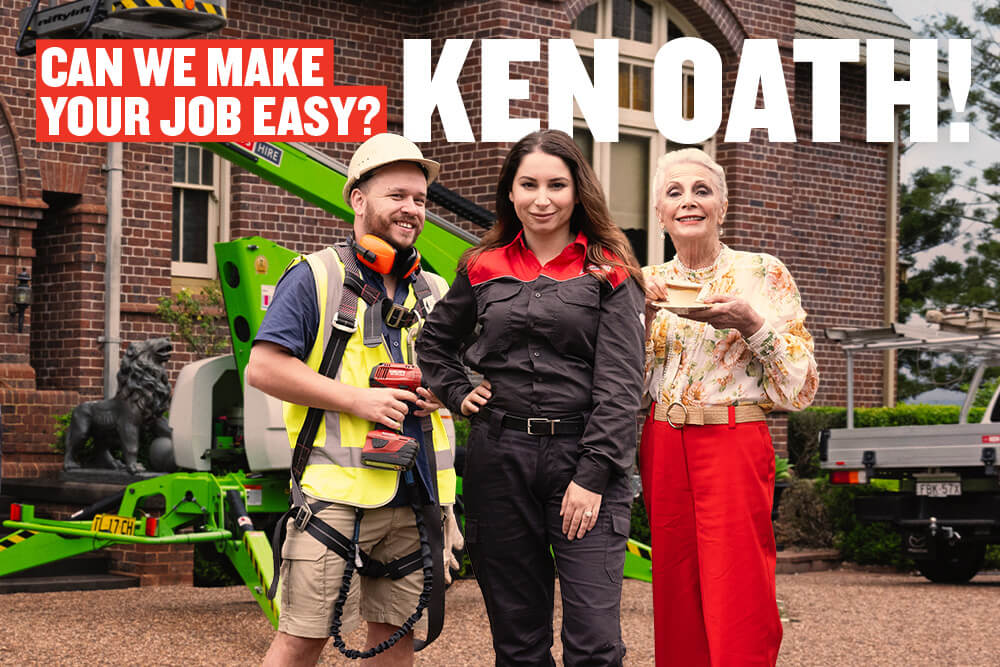 Kennards Hire team member, a tradie and an old woman standing in front of a mansion