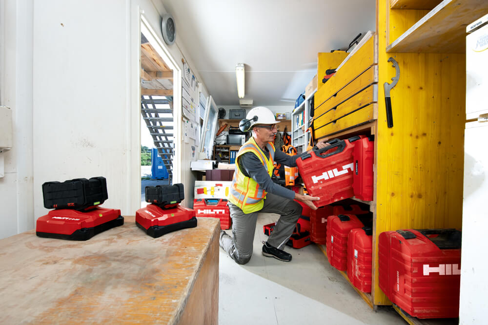 Man putting Hilti case on shelf