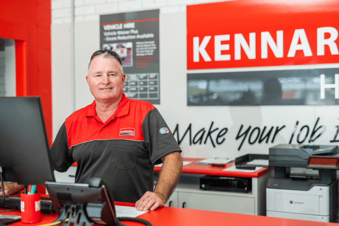 Kennards Hire team member manning the service desk in branch