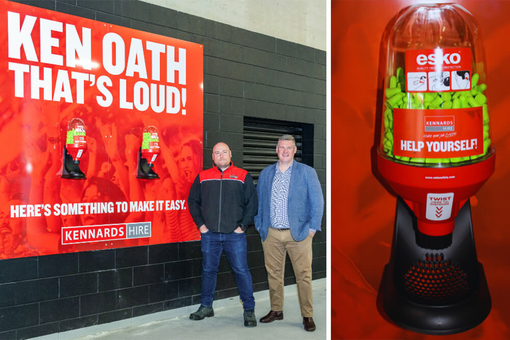 Two men standing next to a noise sensitivity station at Forsyth Barr Stadium