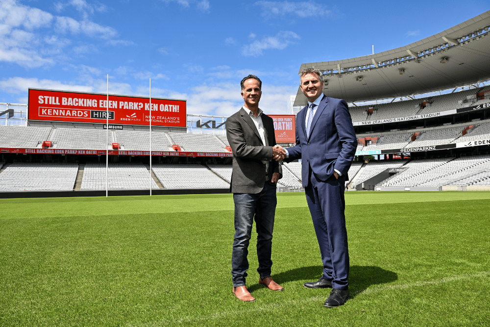 Kennards Hire Richard White shaking hands with CEO Nick Sautner at Eden park
