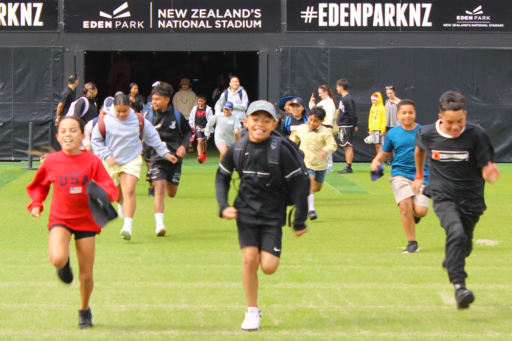Kennards Hire kids sport kids running at Eden Park