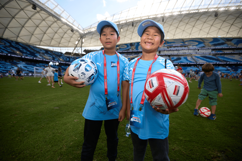 Kennards Hire Sydney FC kids bay kids on the field at a Sydney FC match