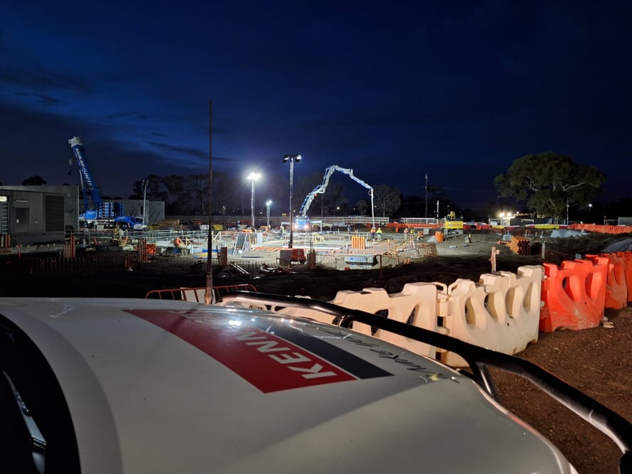 Kennards Hire ute at a job site during the night with lighting towers lit up