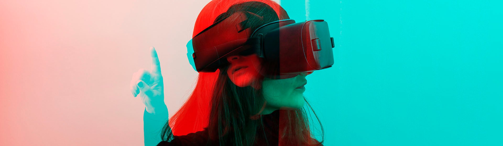 Lewis Silkin Person wearing VR glasses double exposed, overlaid with blue colouring on their right & red left