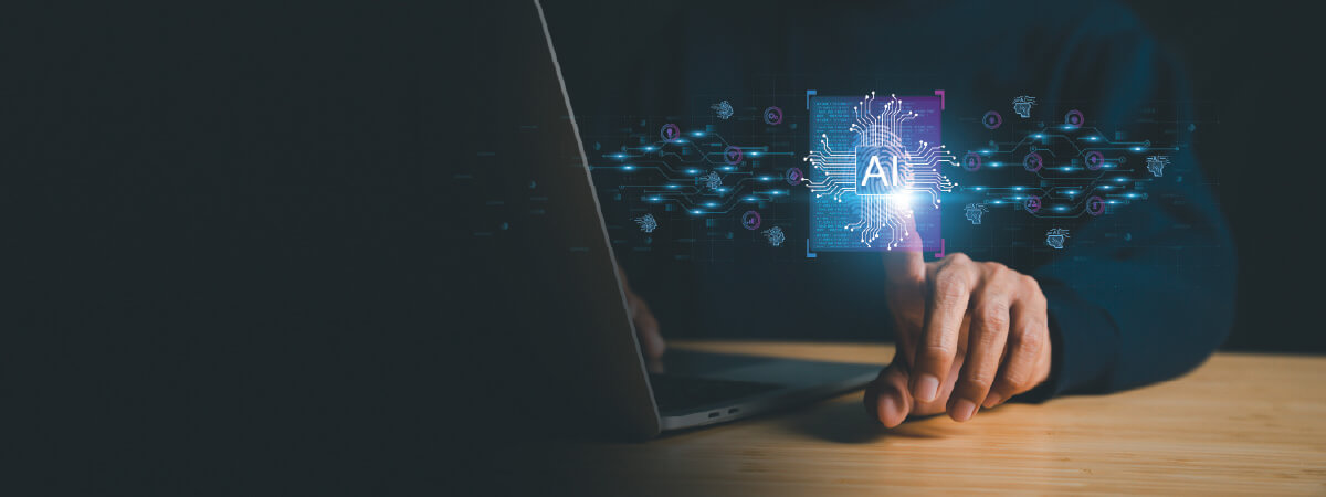 Person using a laptop reaches out to a floating representation of AI