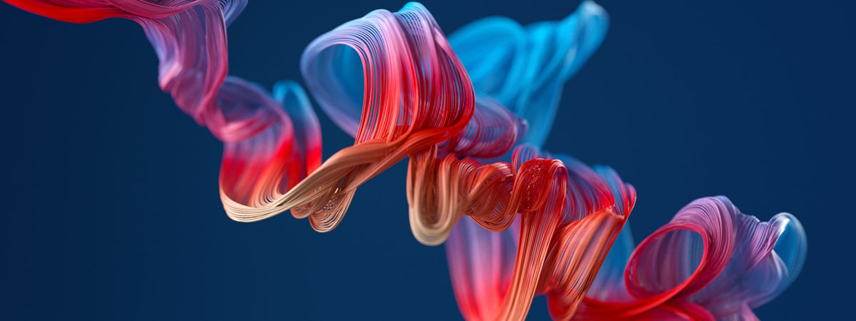 A fluid colourful pattern swirling in front of a dark background