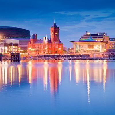 Cardiff bay at dusk, lights from the Pierhead building & Millennium Centre form long reflections on the water