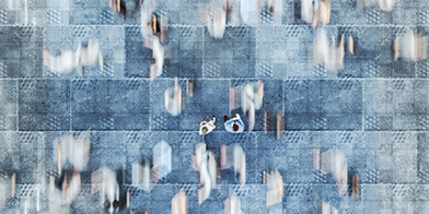 Soft focus image of people standing in a crowd